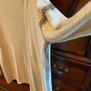 Johnny was tan sweater